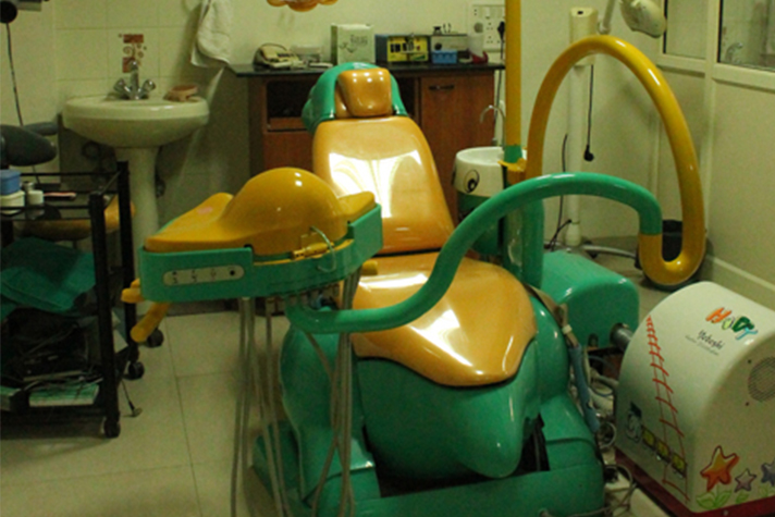 Green and yellow children's dental chair