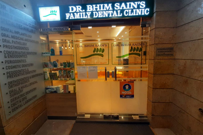 Clinic entrance with Dr. Bhim Sain's Family Dental Clinic signage